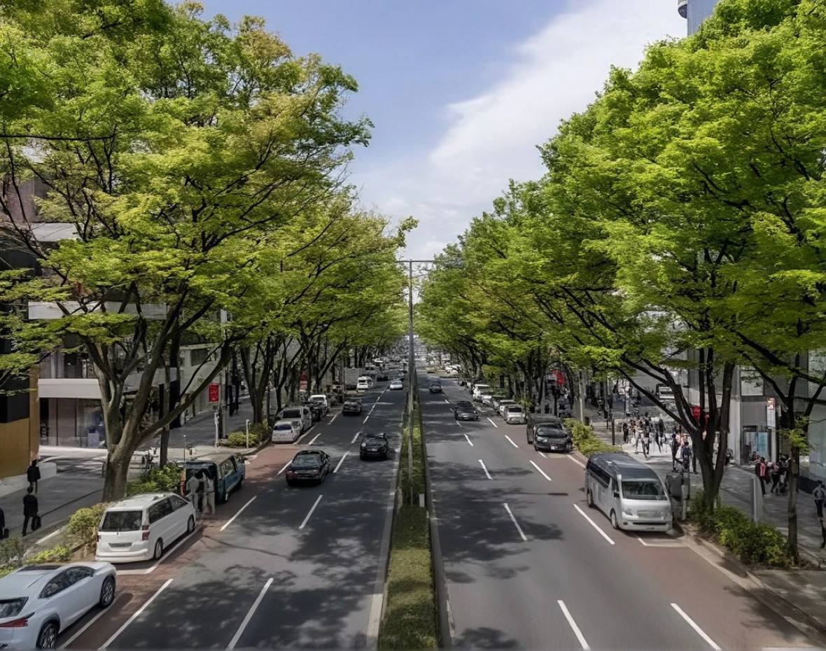 Tree-lined urban street with landscaped median and surrounding buildings