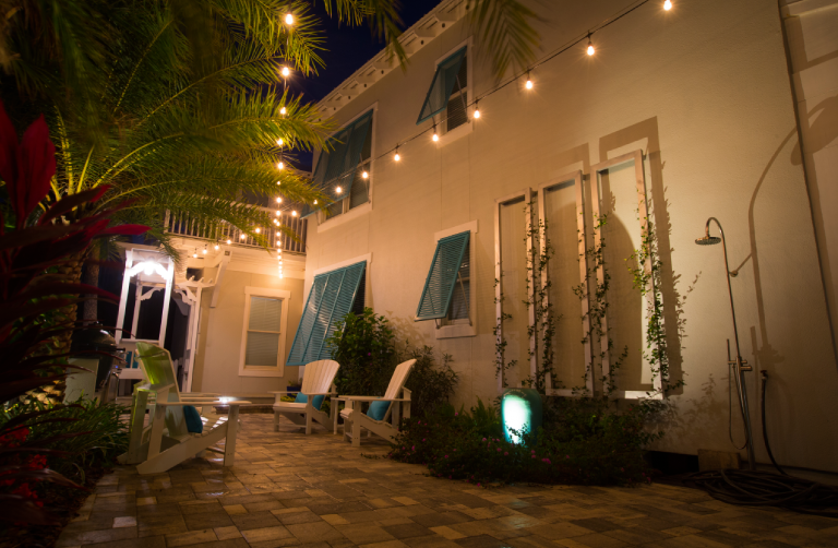 Tropical backyard with Adirondack chairs